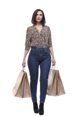 in full growth.attractive young woman with shopping bags.