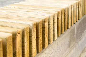 New modern bench in park. Outdoor city architecture, wooden benches, outdoor chair, urban public furniture, empty plank seat, comfortable bench in recreation area