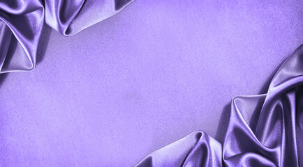 Beautiful purple pink silk satin background. Soft folds. Shiny fabric. Luxury lilac background with...