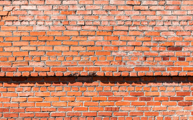 An old weathered red brick wall. Background and texture of brickwork