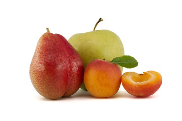 Fototapeta na wymiar Whole and halved ripe apricot, pear and green apple