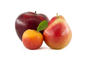 Apricot, pear and red apple isolated on a white