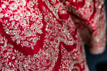 Indian Hindu bride's wedding outfit textures, pattern and red fabric