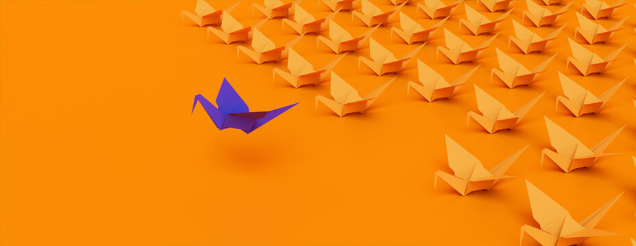 Winner Concept with Origami Birds on a Orange background. 