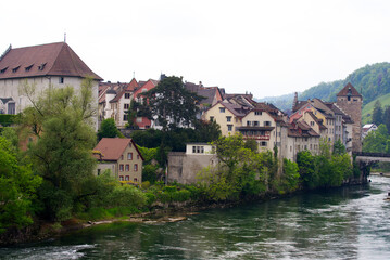 Fototapeta na wymiar Bridge over River Aare at City of Brugg, Canton Aargau, on a cloudy spring day. Photo taken May 6th, 2022, Brugg, Switzerland.
