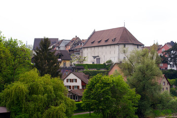 Fototapeta na wymiar Old town of City of Brugg, Canton Aargau, on a cloudy spring day. Photo taken May 6th, 2022, Brugg, Switzerland.