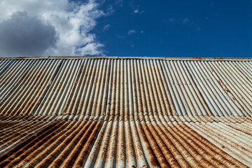Rusty corrugated iron roof texture.