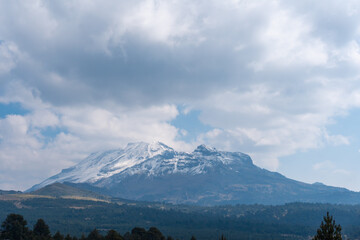 Top of Iztaccihuatl volcano covered with snow.