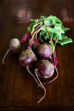 Overhead view of raw beetroots with leaves left on