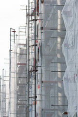 Scafolding with nets covering a new apartment house building