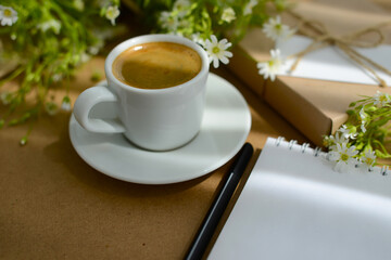 Coffee, spring flowers, gift box and note paper, soft focus, blurred background, copy space
