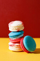 Colorful Macaroon, Stacked on Yellow and Red Background
