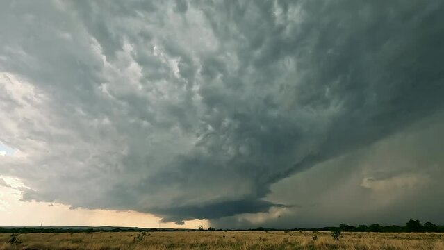 Timelapse of dangerous thunderstorm moving over the landscape in Texas during extreme storm warning.