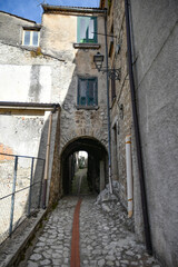 Fototapeta premium A narrow street between the old houses of Petina, a village in the mountains of Salerno province, Italy.