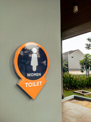 Women restroom signage in a park in the city
