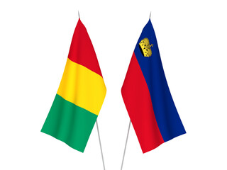 National fabric flags of Guinea and Liechtenstein isolated on white background. 3d rendering illustration.