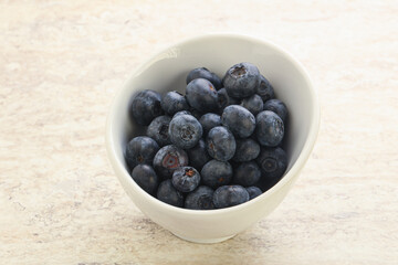 Sweet ripe blueberry heap in the bowl