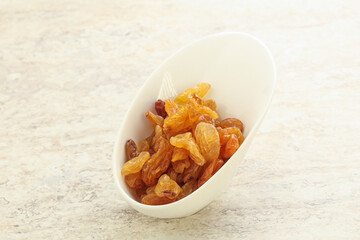 Sweet yellow raisin in the bowl