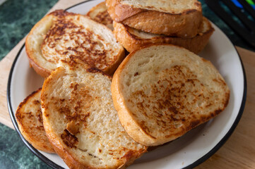 fried slices of wheat bread on a plate