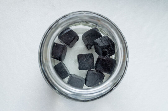 a jar of water and shungite cubes. Top view