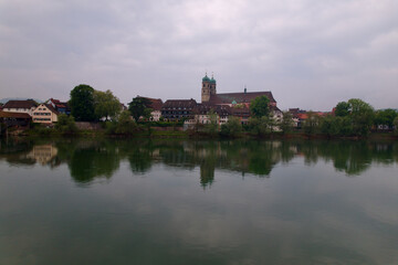 Fototapeta na wymiar City of Bad Säckingen, Baden-Württemberg, with church and Rhine River on a cloudy spring day. Photo taken May 6th, 2022, Stein, Switzerland.