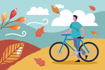 man riding bike in autumn landscape
