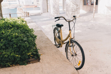 Fototapeta premium Old Cycle sitting on the street of old middle eastern street with rusted rims and old dynamo connected for light