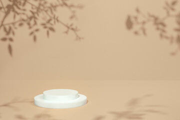 Abstract minimal nature scene - empty stage and circle podium on beige background and soft shadows of rose flowers and leaves. Pedestal for cosmetic product and packaging mockups display presentation