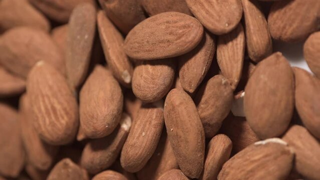 Almonds heap rotating with close up shot, full frame raw food background - stock video