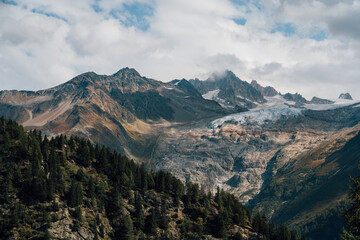 Wide View of Swiss Alp Mountains with Scattered Snow - 508585752