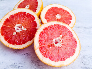 Cut  grapefruits  on a gray textured background 