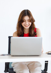 Asian excited happy female traveler in casual outfit sitting looking at laptop computer holding fists up celebrating after lucky winning free travelling trip vacation holiday package prize online