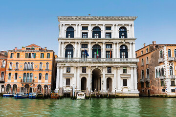 Fototapeta na wymiar Buildings on the banks of the Grand Canal with the Palazzo Grimani in the center. Venice, Italy