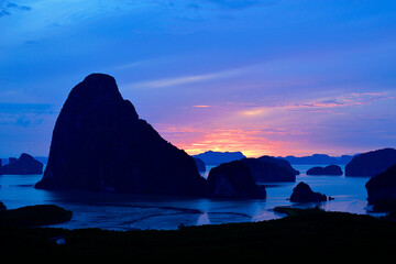 Sunrise Samet Nangshe Viewpoint, limestone karst formations and small islands at Phang Nga Bay with the beautiful clouds background, Phang-Nga province Thailand