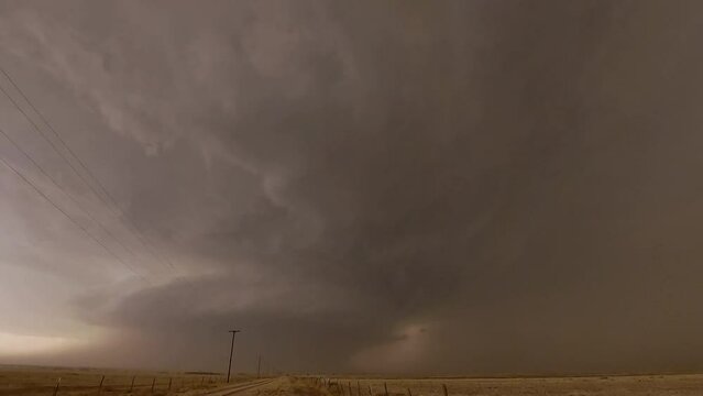 Lightning flashes as it strikes the ground in front of tornado supercell in Texas near Morton.
