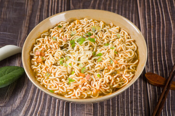 cooked instant noodles in a bowl on table