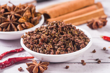 Assortment of east spices and seasonings on wooden table by close up