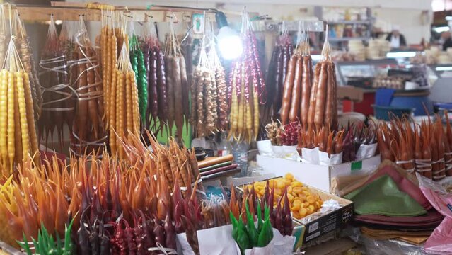 fresh Georgian sweet Churchkhela displayed at a market in Kutaisi, Georgia. High quality 4k footage