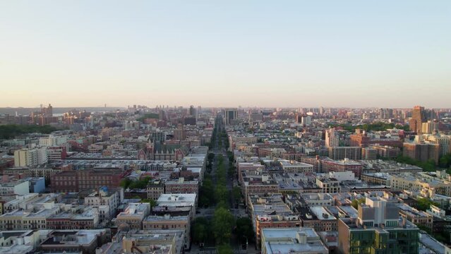 Harlem NYC drone shot with apartments, buildings, park space, cars