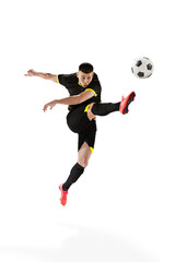 Professional male football soccer player in motion and action isolated on white studio background....