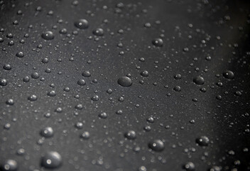  water drops on black background close up
