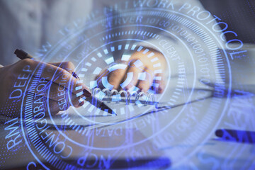 Multi exposure of woman's writing hand on background with data technology hologram. Concept of innovation.