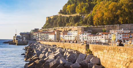 Rocks and white houses at the waterfront in San Sebastian, Spain