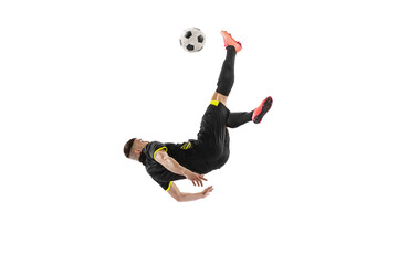 Dynamic portrait of professional male football soccer player training isolated on white studio...