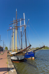 Fototapeta na wymiar Historic tall ships at the quayside of Kampen, Netherlands