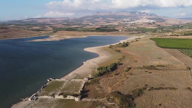 Aerial drone. Rows of Vineyards at Fortino di Mazzallakkar, Arab fort in Sambuca di Sicilia, Sicily, on Lago Arancio. This area is well known for the production of grapes and white and red wine.