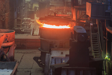 Casting ladle lining process in factory workshop.