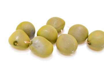 Nucker nut, Grey nickers, Bonduc nut, Gray nicker (Caesalpinia. Bonduc (L.) Roxb.) Seeds, medicinal properties and it is believed that a magic charm. Bonduc nut seed isolated on white background.