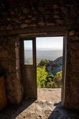 Obraz premium View of Mountains Through a Cabin Door in Sierras de Cordoba,Argentina