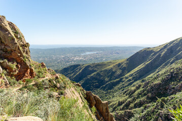 Naklejka premium Scenic View of a Town from a Mountain Against a Clear Sky